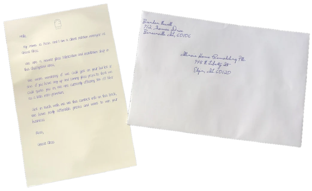 A handwritten letter on cream paper beside a hand-addressed envelope